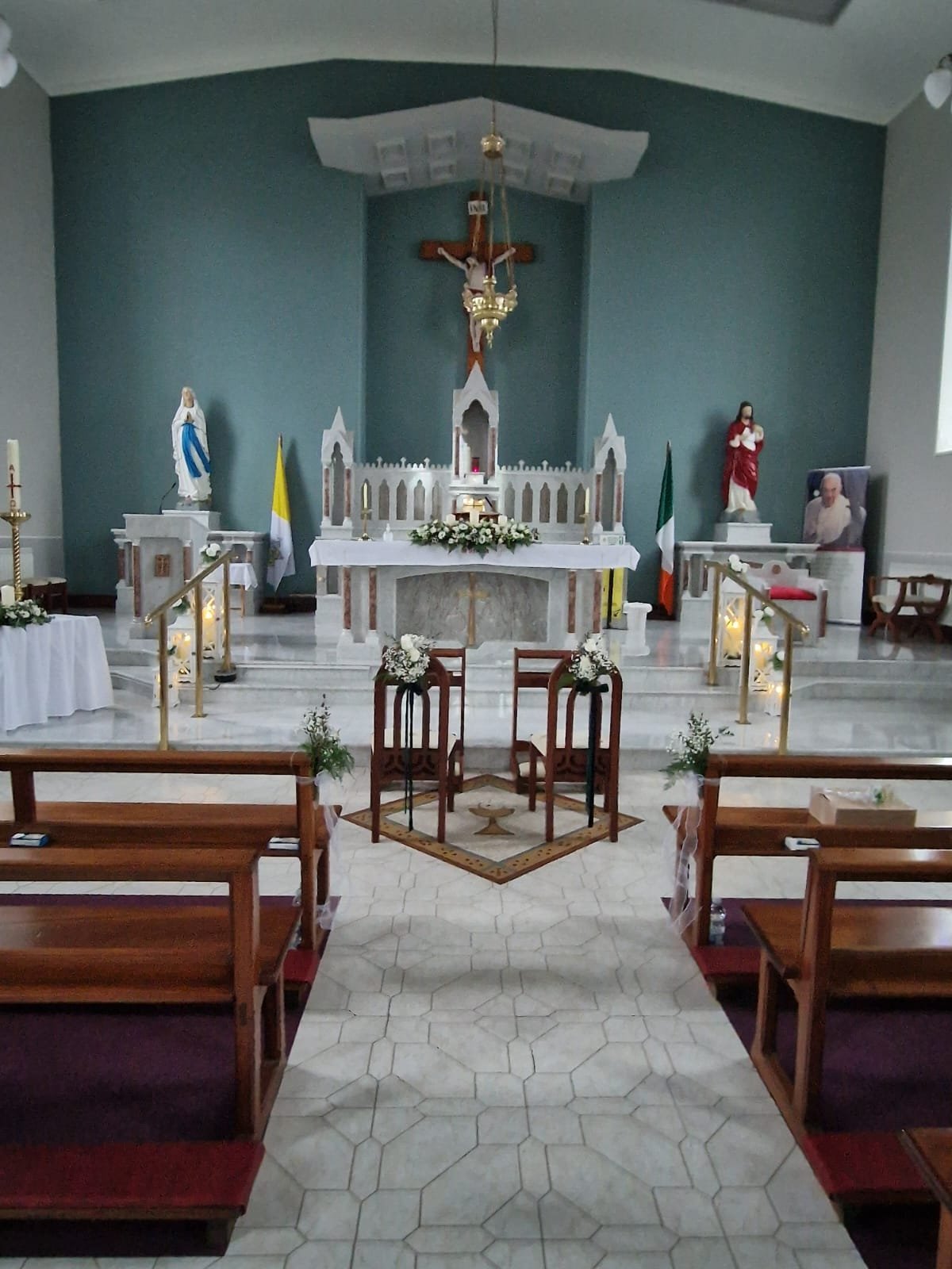 Pew ends with flowers and ribbon